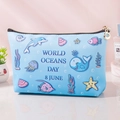 Portable blue PU makeup bag with cartoon ocean animal prints for travel storage - Blue Background Marine Life