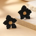 Elegant black layered flower earrings with golden stamen on a minimalist stone display - Black KC Gold (WEH1955)