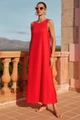 Detail of red sleeveless maxi dress featuring a scalloped wavy side trim and side slit - S / Red