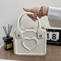White EVA beach handbag with embossed 3D heart pattern and integrated handle design - White