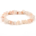 Macro shot of irregular natural pale orange stone beads on an elastic stretch bracelet - Pink Aventurine