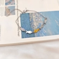 Bracciale con ciondoli a forma di pesce regolabile in tonalità oro e argento - Bracciale Pesce d'Oro Upstream