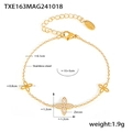 Macro shot of gold stainless steel bracelet detailing zircon flower pendants and S.steel stamp - Four Leaf Flower Zirconia Style / Gold Bracelet