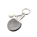Miniature table tennis racket keychain with white ball and textured black rubber surface - Black