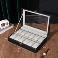 12-slot black leather watch box with glass lid and metal lock on a wooden desk - 12-Slot Watch Box Black/Grey Interior