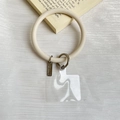 Universal silicone phone wrist strap in beige with silver metal ring and clear patch - Light Gray