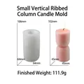 Detailed view of striped pillar candle silicone mold with finished pink wax product - Small Ribbed Pillar Mold