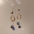 Orecchini etnici in legno con cerchio geometrico, nappe e perle blu a goccia - Gancio per Orecchio - Oro - Marrone