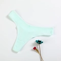 Close-up of mint green ribbed cotton thong with texture detail on white background - Light Green