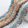 Macro detail of teardrop glass crystal beads with iridescent AB coating for jewelry DIY - 100 Pcs/Pack / Multicolor