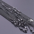 Macro shot of 2mm black stainless steel ball chains and link chains with lobster clasps - Black