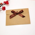 Kraft paper envelope featuring a dark brown satin bow for greeting cards and invitations - Envelope with Coffee Ribbon