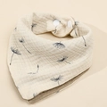 Detail of four-layer cotton baby bib featuring dandelion print and snap fasteners - Dandelion + Coffee