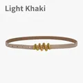 Modern light khaki leather skinny belt with elegant wavy golden metal buckle closure - Light Khaki