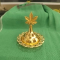Detail of golden metal incense burner with hollow pattern and leaf-shaped top ornament - Five-Pointed Leaf Top C