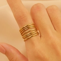 Six-layer stacked gold ring with hammered and frosted texture on model's index finger - 18K Gold Multi-Layer Stacking (11526)
