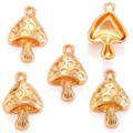 Détail de cinq pendentifs champignon dorés polis pour la création de bijoux DIY créatifs - Or KC