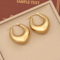 Macro view of chunky gold hoop earrings with a polished mirror finish on a jewelry tray - Waterdrop Chunky Hoop Style (9#)
