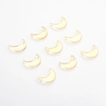 Flat lay of nine crescent moon glass charms with gold glitter for DIY jewelry making - Gold Pink