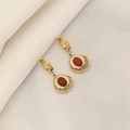 Detail of vintage gold earrings with oval ruby inlay and radial striped patterns - Red Agate Earrings