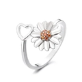 Adjustable silver spinner ring featuring a white daisy flower and hollow heart design - Heart Petal Spinner