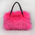 Detail of pink faux fur tote bag showing long plush texture and black leather handles - Rose Red