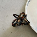 Close-up of small tortoiseshell acetate butterfly hair claw with hollow design detail - Dark Blue Coffee/Tortoise