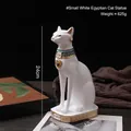 Egyptische Bastet kat kaarsenhouder van matwitte hars met gouden halsband en gouden oorbellen - Witte Egyptische Kat - Klein