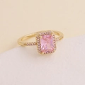 Fashionable golden halo ring featuring a rectangular pink zircon stone with micro-pave details - US 6 / Gold