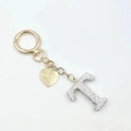 Detail of heart tag with I LOVE YOU engraving and sparkling crystal letter T keychain - Letter T