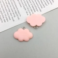 Close-up of two pink resin cloud pendants with metal loops for DIY jewelry making - Pink Resin Cloud