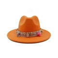Detail of orange felt fedora featuring woven band with shell accents and colorful tassels - Orange
