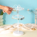 Rotating three-tier white metal earring organizer shown with hand adjusting jewelry - 3 Layers White 130 Holes