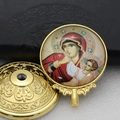 Close-up of golden metal religious icon featuring Mary and Jesus with embossed details - Gold-2 (Virgin Mary & Infant Jesus)