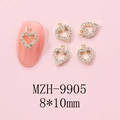 Macro view of gold heart nail art charm with rhinestones and 8x10mm size markings - Gold Heart Rhinestone Hollow Charm (9905)