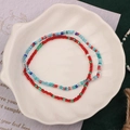Handmade colorful beaded bracelets in red, green, and blue on a white shell tray - Style 12-Double Red Green Blue