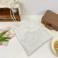 Detail of light blue canvas tote bag featuring cute cat prints and a Szakka woven label - Printed Cat Light Green