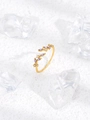 Detailed macro shot of adjustable gold leaf ring with purple marquise zirconia accents - Purple