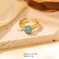 Golden titanium steel open ring featuring a wave texture and oval turquoise stone inlay - Adjustable Open / Gold Wavy Pattern with Oval Turquoise (JOM25011)