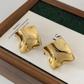 Irregular twisted gold wave stud earrings displayed in a vintage wooden jewelry box - Silver Pin - Real Gold Plated / Gold