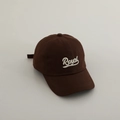 Detailed view of the royal letter embroidery on the brown cotton twill baseball cap - 52-54cm (3-8 Years) / Coffee