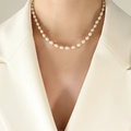 Baroque freshwater pearl choker with gold beads on model wearing a beige blazer - Gold Pearl Necklace / 38+7cm