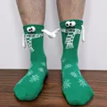 Detail of green Christmas socks with 3D hands and magnetic connection on a person - Green Snowflake Magnetic Hand Holding