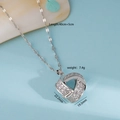 Zilverkleurige geometrische hartvormige ketting met glinsterende zirkonia stenen - Ketting / Zilver