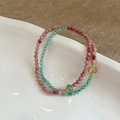Pink and green beaded natural stone bracelets with gold accents on a white plate - Red Wood Grain & Green Aventurine Patchwork Bracelet