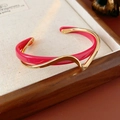 Close-up of double-layered geometric open bangle with pink enamel and gold wave design - Double Layer Intertwined (HB437) / Gold/Pink