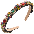 Macro view of colorful crystal floral embellishments on a baroque headband detail - Colorful