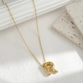 Minimalist gold necklace featuring a 3D letter R pendant on a delicate chain - Letter R