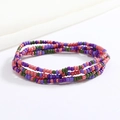 Close-up of handmade colorful seed bead body chain with pink and green bohemian style - Pink Purple Green