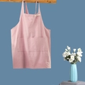Pink cotton linen apron with large front pocket and adjustable straps on hanging bar - Kids Pink